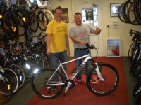 Scott Caygill presenting Raffle winner Ian Hewitt with his new bike. A very happy man. Enjoy Ian!